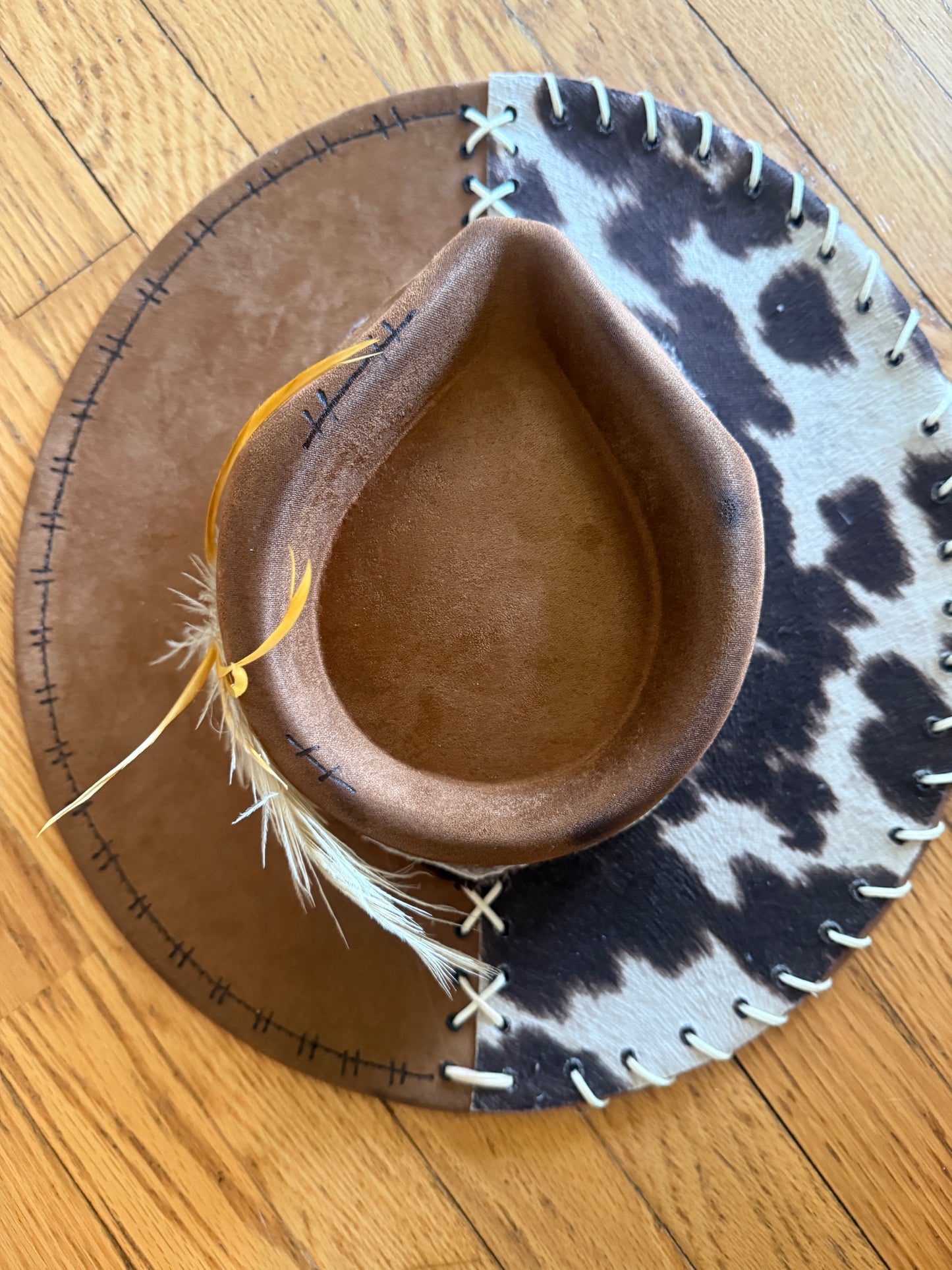 Faux cow hide with stitching