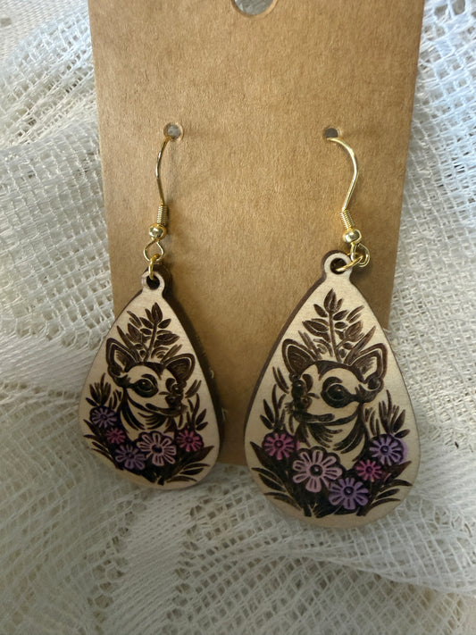 Wooden earrings with a dog and a floral design.